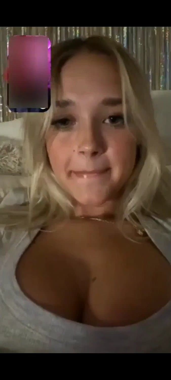 Pretty blonde happy to make him cum by showing her boobs and sticking out her tongue