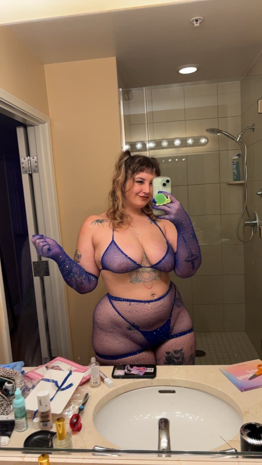 Looking real good in the blue fishnets and lingerie