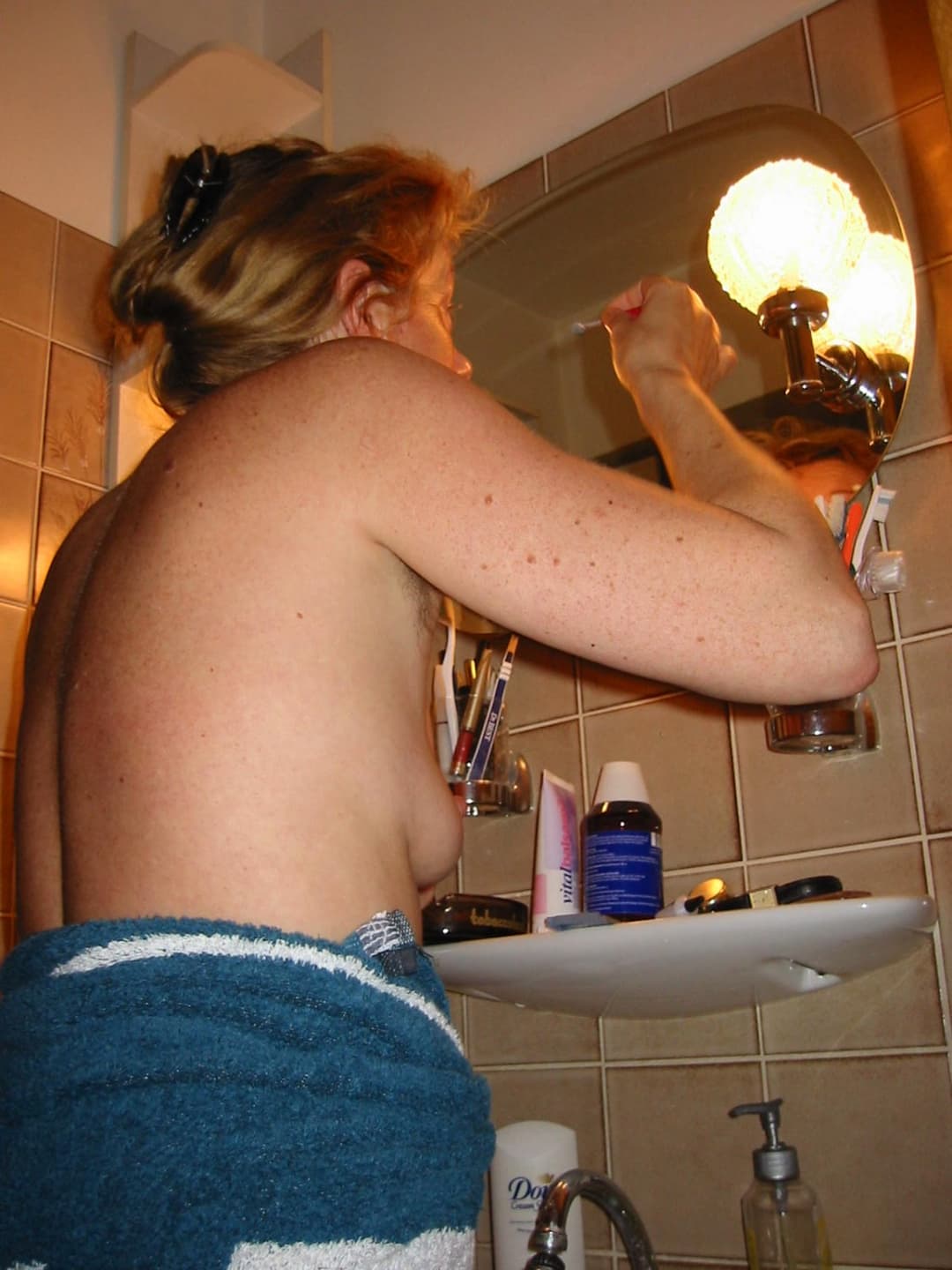 Old slut gets ready for friends in the bathroom