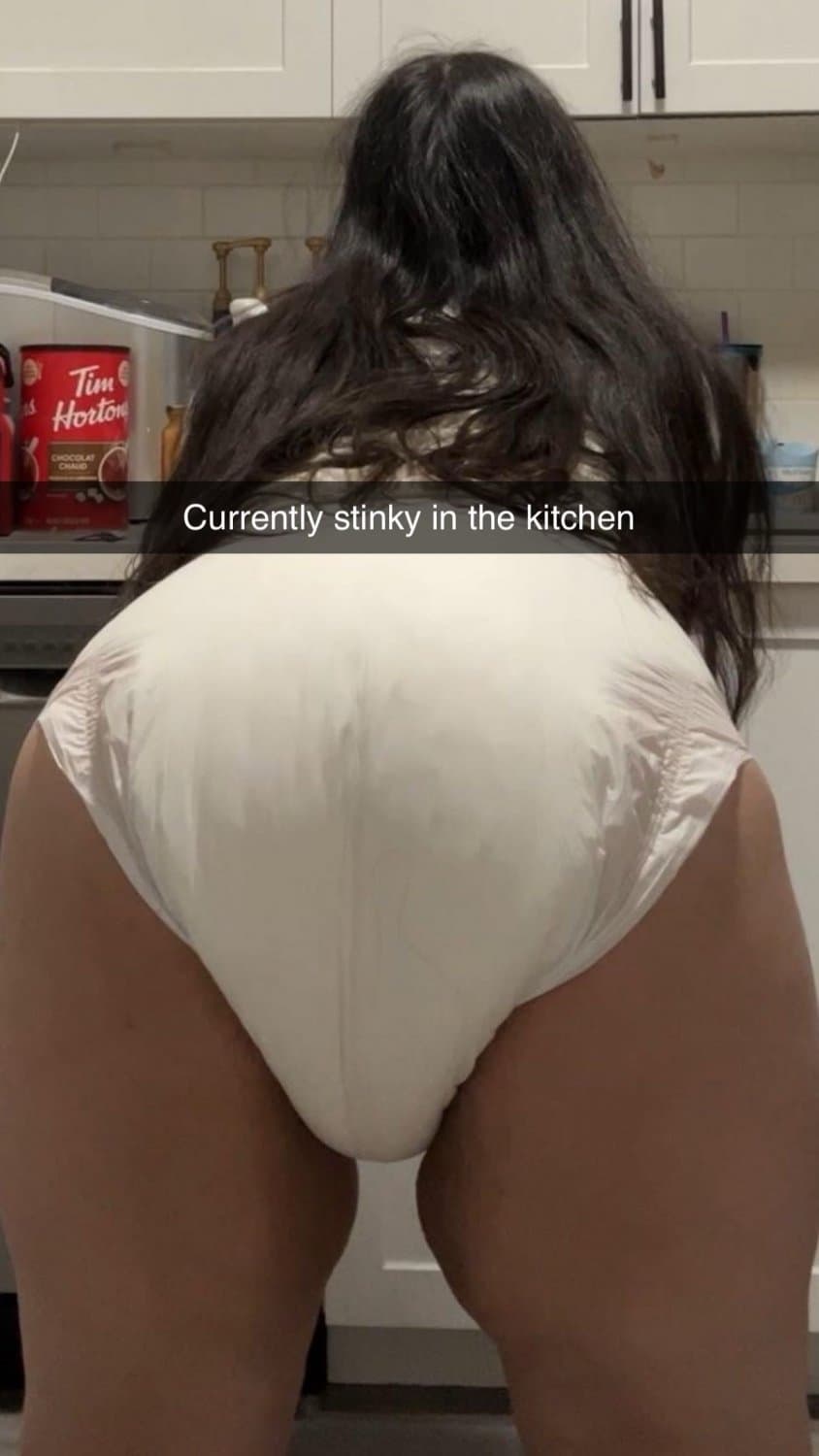 Click to view full size Incontinent college girl doesn’t mind showing off her diapers