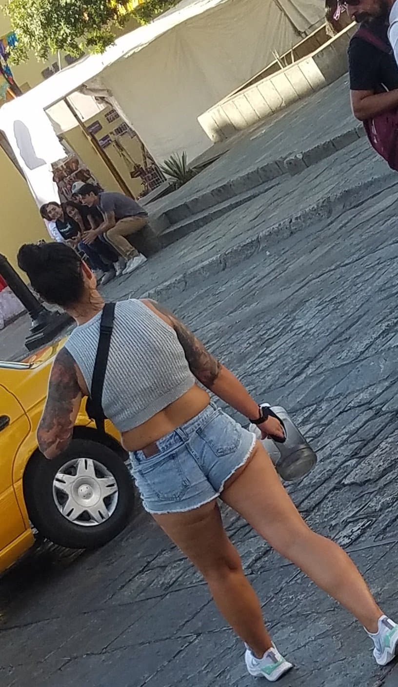 Nice legs and a little peach showing, shorts