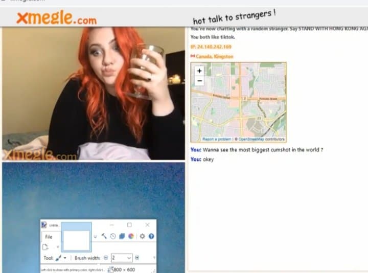 Red-haired beauty relaxes in video chat