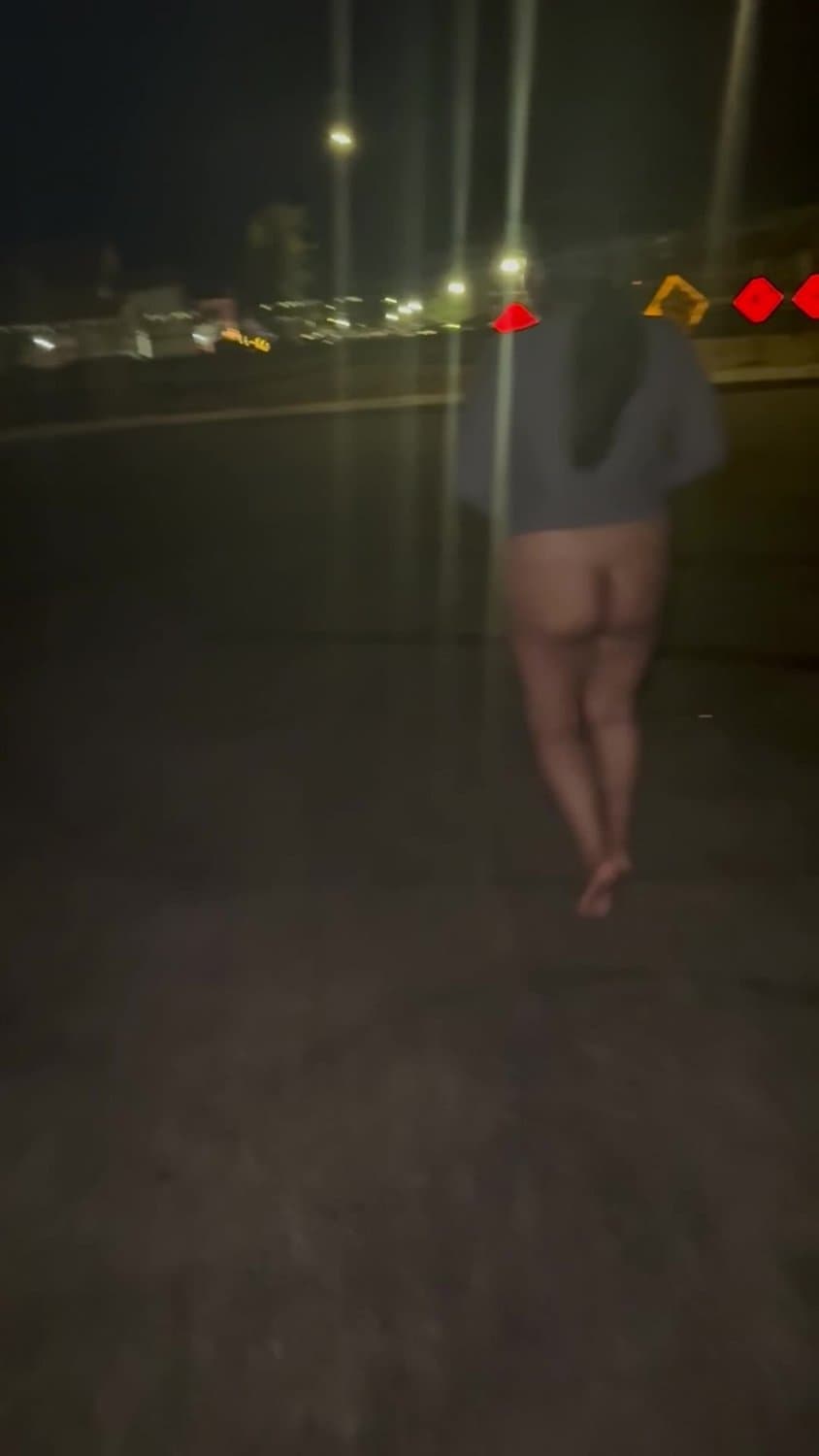 Risky Latina walking in the public street with pussy out almost caught