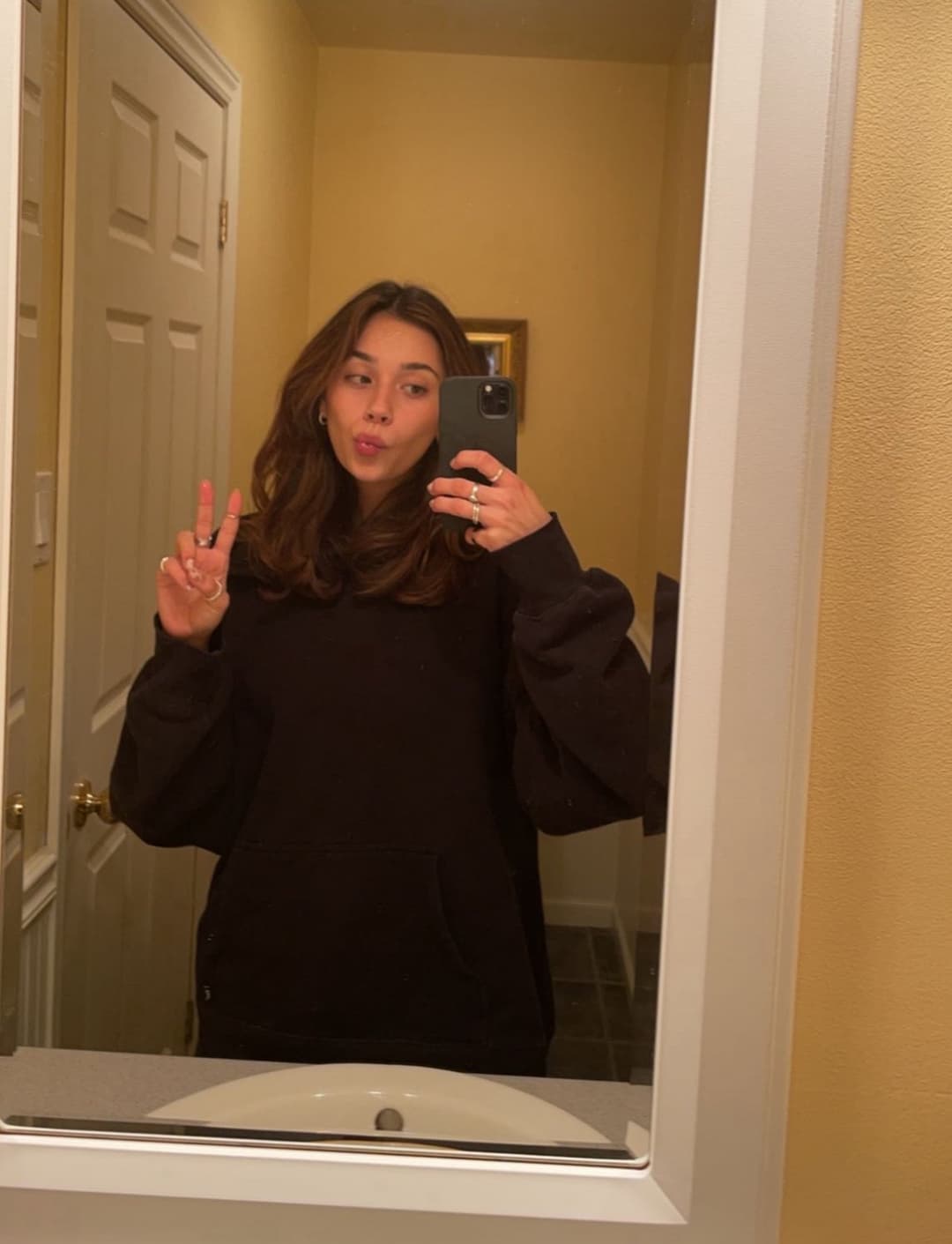 Big Tit Brunette hiding her hushpuppies under her clothes!