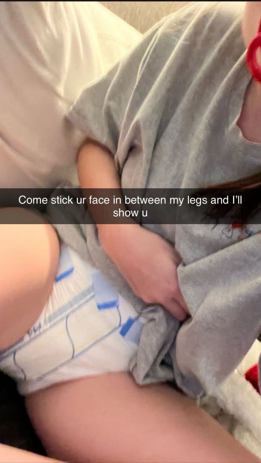 Cute tanned girl shows off her diapers and pull-ups