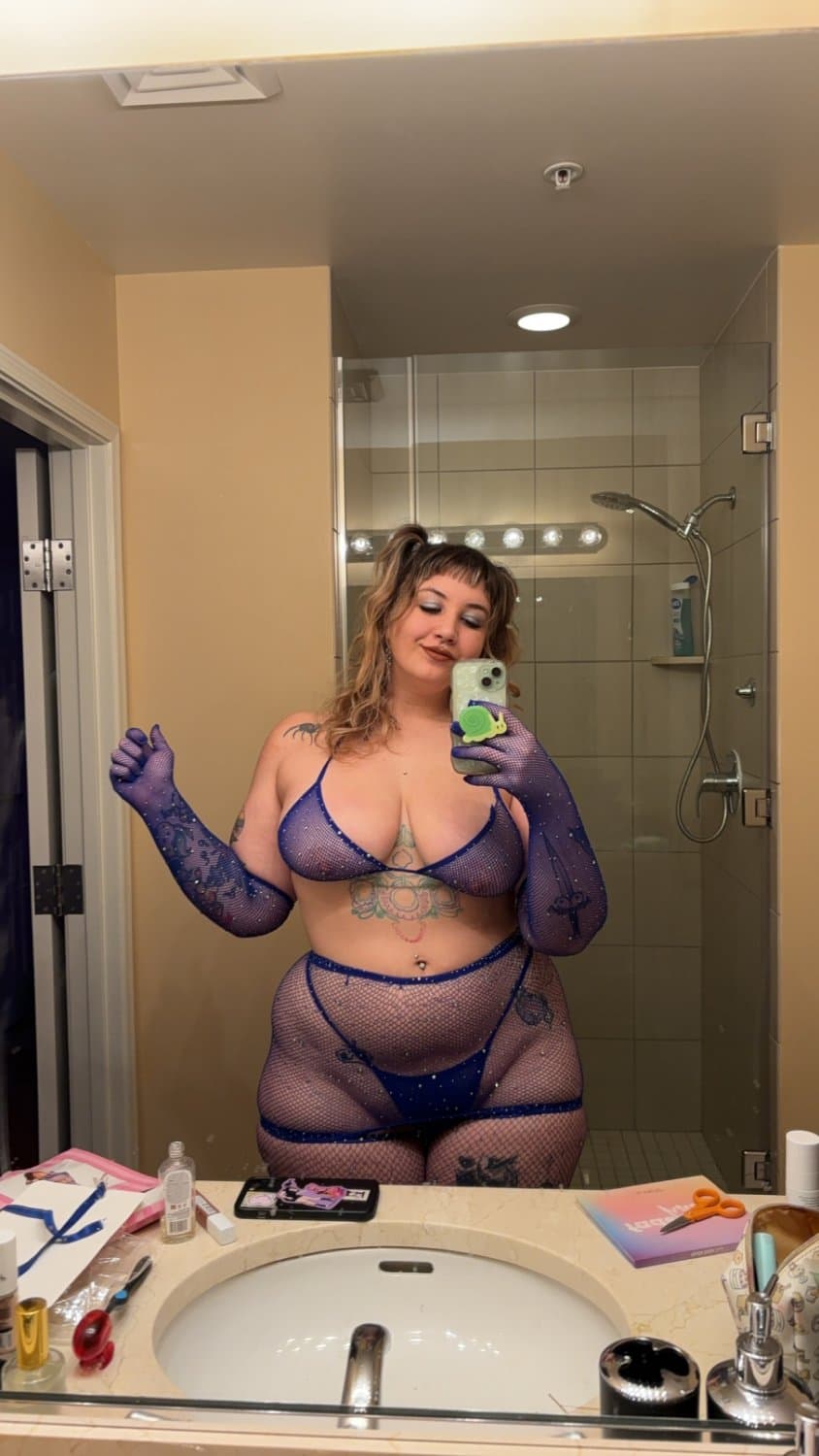 Looking real good in the blue fishnets and lingerie