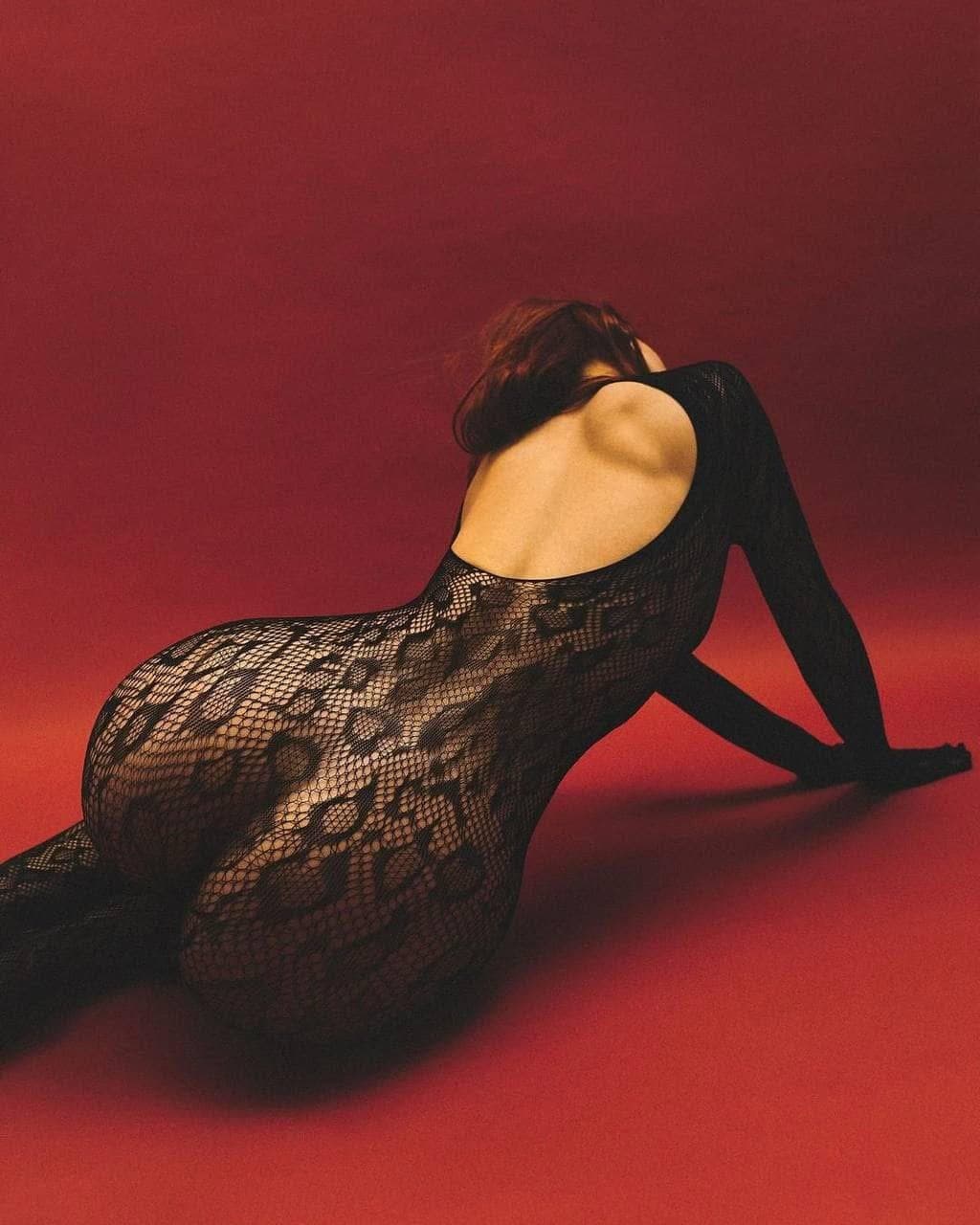 Sexy brunette in fishnets pantyhose