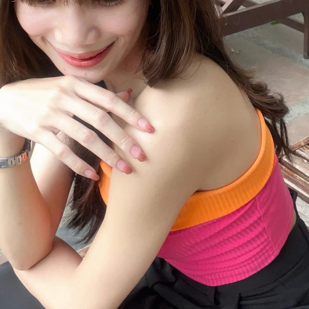 She has a very beautiful and charming smile.