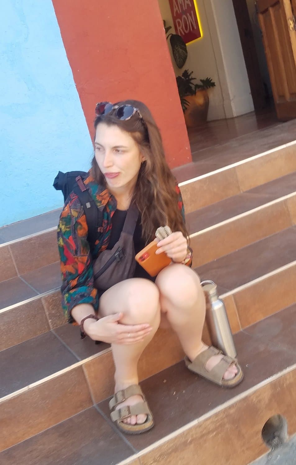 some girls sitting, showing legs and little else