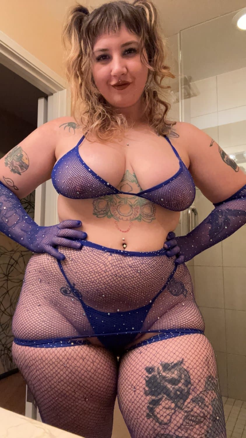 Looking real good in the blue fishnets and lingerie