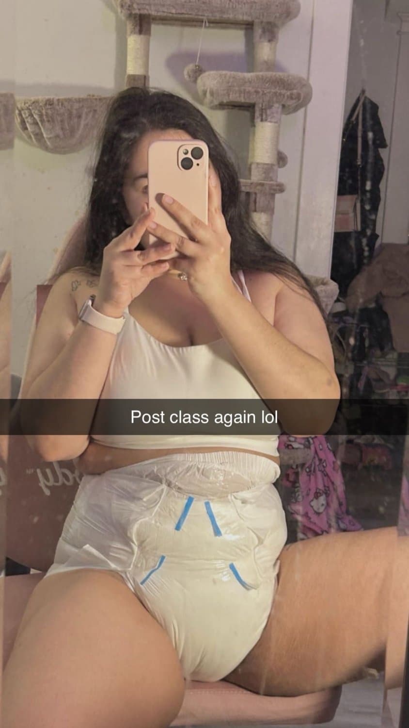 Click to view full size Incontinent college girl doesn’t mind showing off her diapers