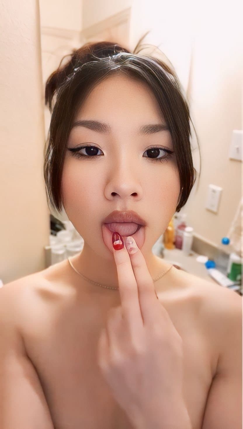 Asian teen Jeanne Nguyen sucking her fingers