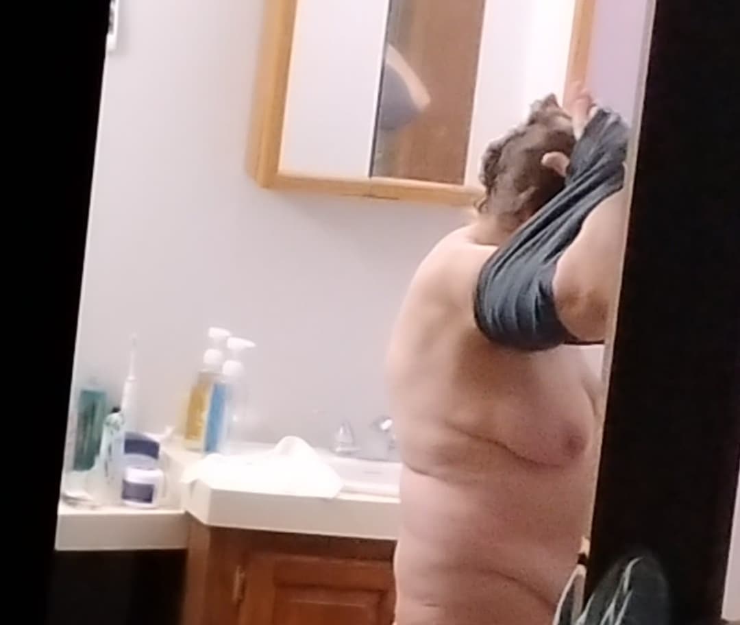 Peeking at my 60-year-old mother getting dressed after taking a shower.