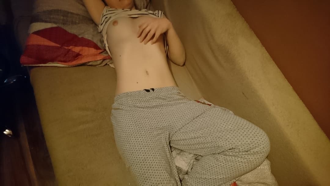 Young teen laying in bed