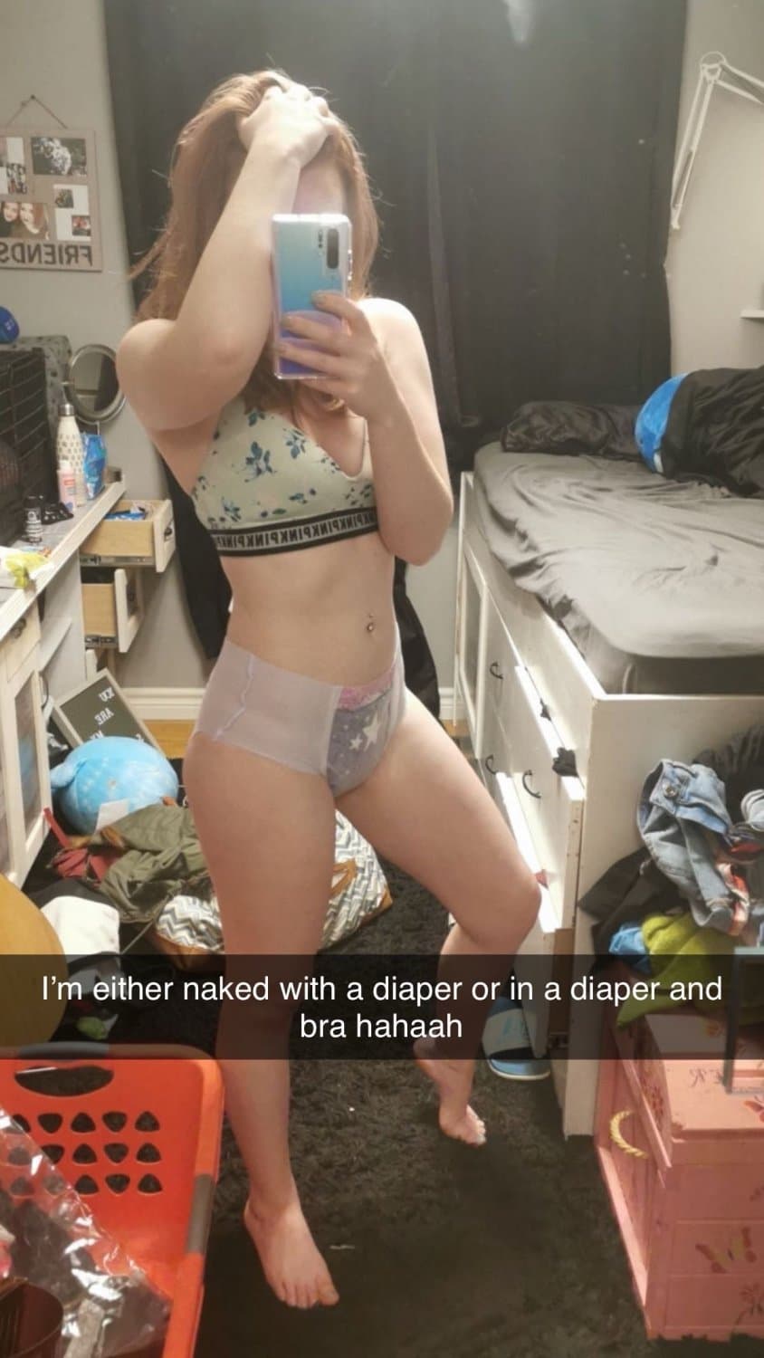 Click to view full size Cute redhead wears diapers for “anxiety”