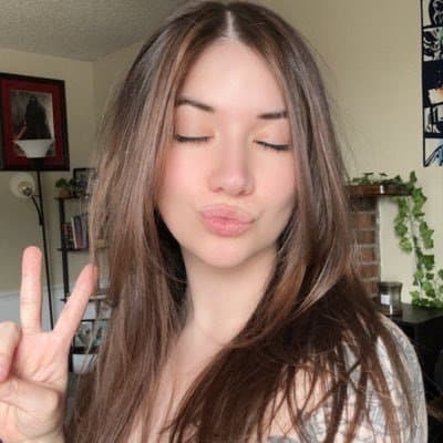 Click to view full size Hottest Milf ever? This curvy slut who loves sticking her tongue out comes damn close