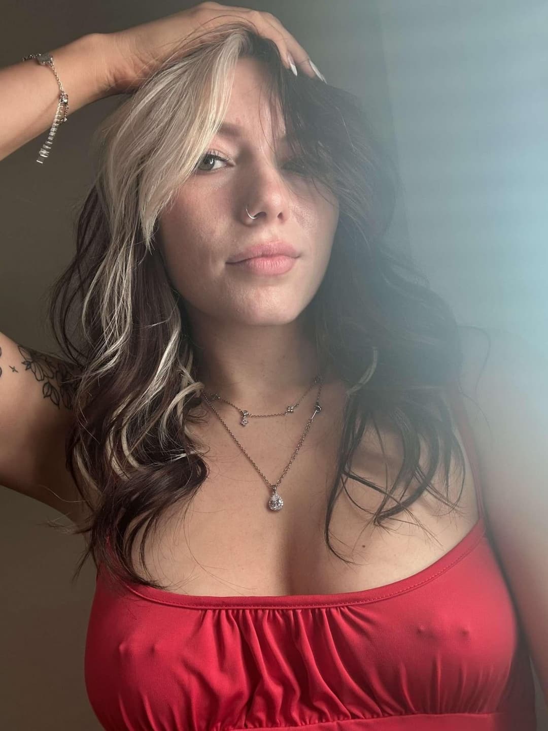 Some busty pierced braless woman ???