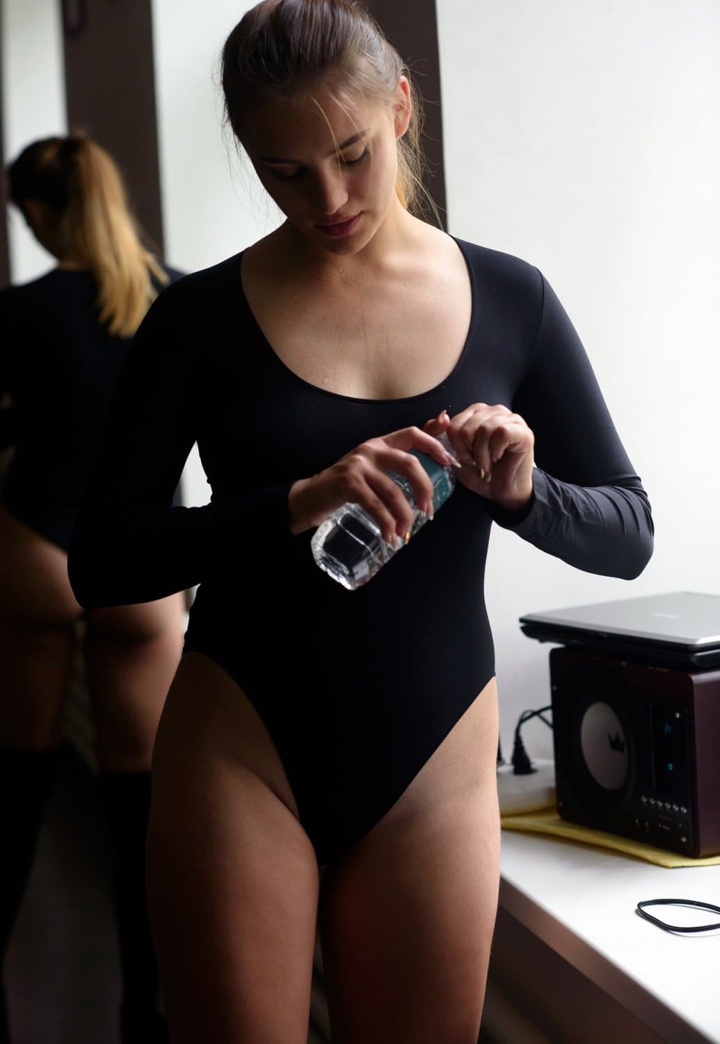 Blonde beauty striping naked while doing yoga