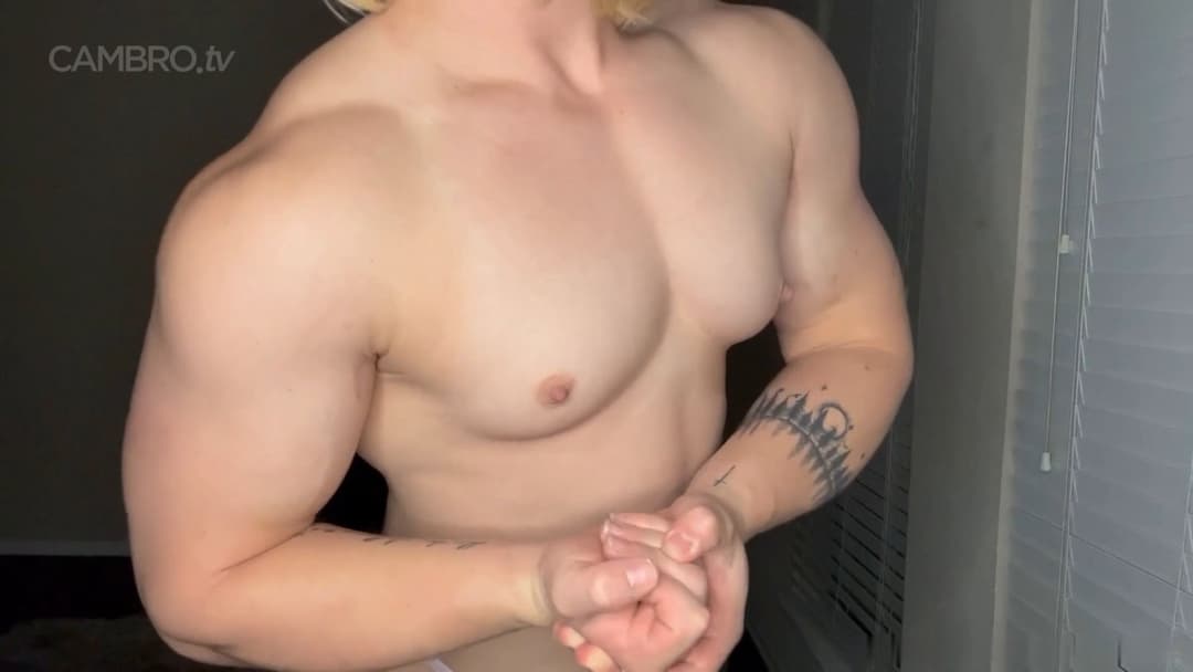 Muscular nudist performing a spermatic bodybuilding show