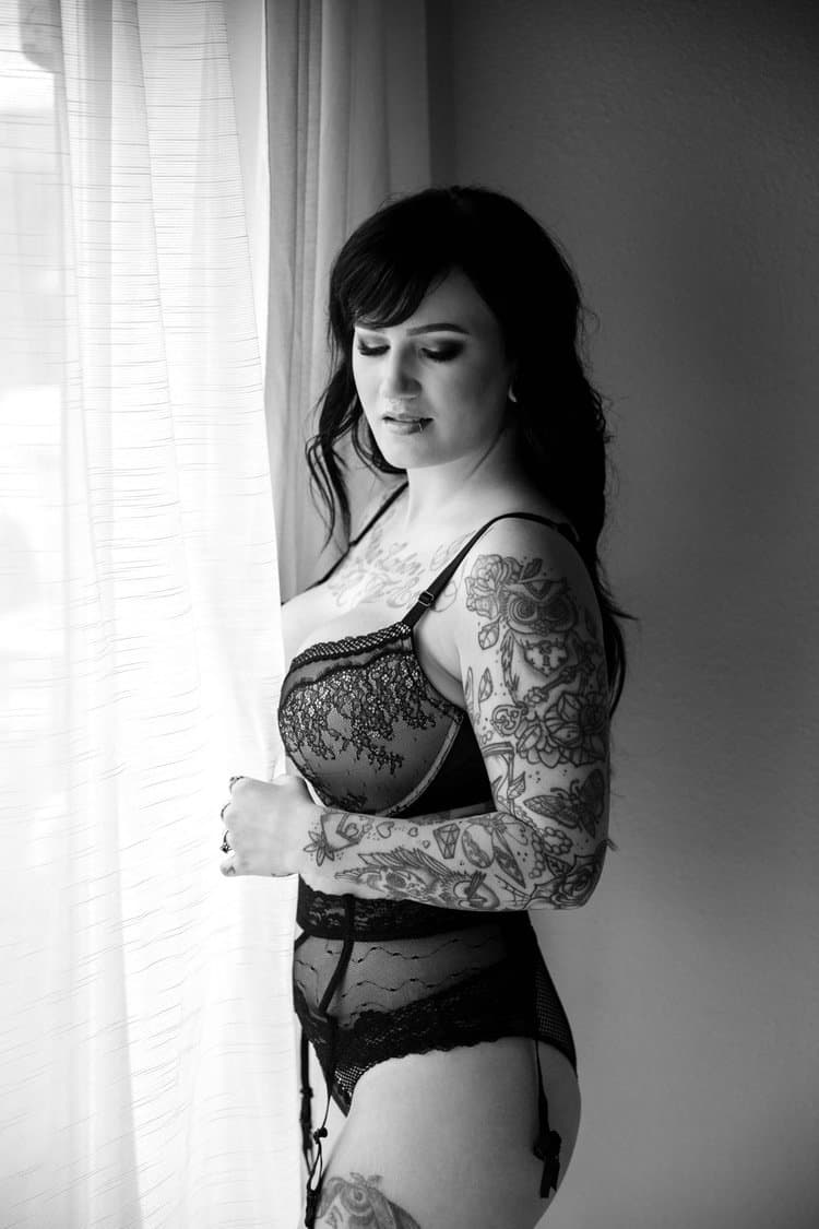 Tatted busty black hair beauty boudoir