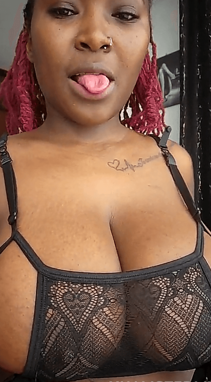 Sexy African teasing big tits