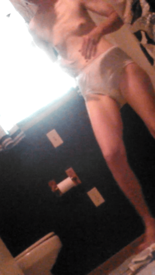 Spying her tiny tits and hairy bush as she puts on her granny panties