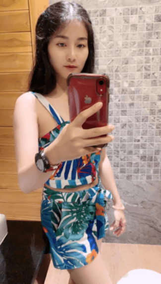 Her husband wants us to see her beautiful figure.