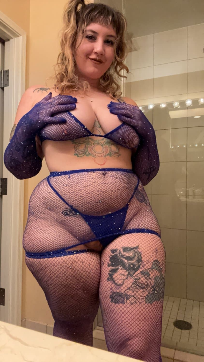Looking real good in the blue fishnets and lingerie