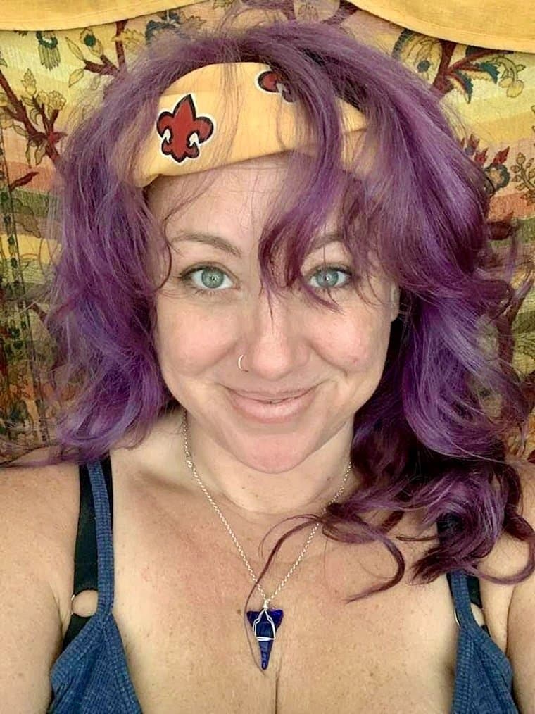 Drunk chick gives a sleazy flash of her pierced titties at Mardi Gras