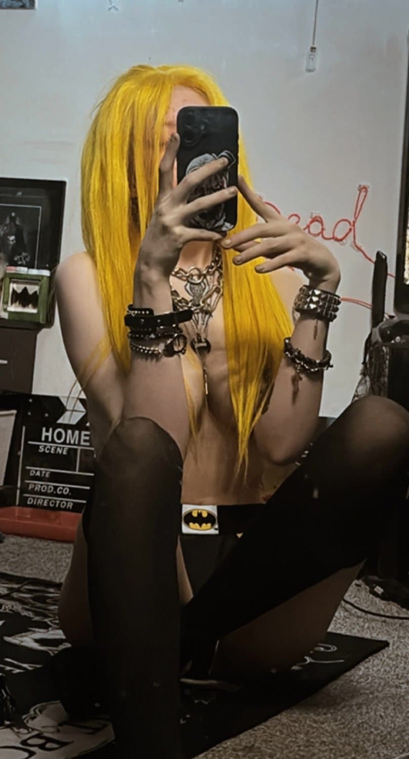 She walks in shadows, a symphony of darkness and allure