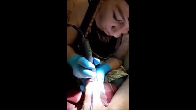 a tattoo artist sucking on her clients cock to keep it hard which is needed for the tattoo (1)