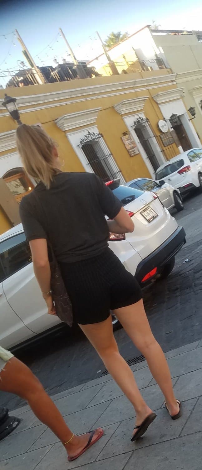 2 friends, blonde and brunette, in shorts, nice legs