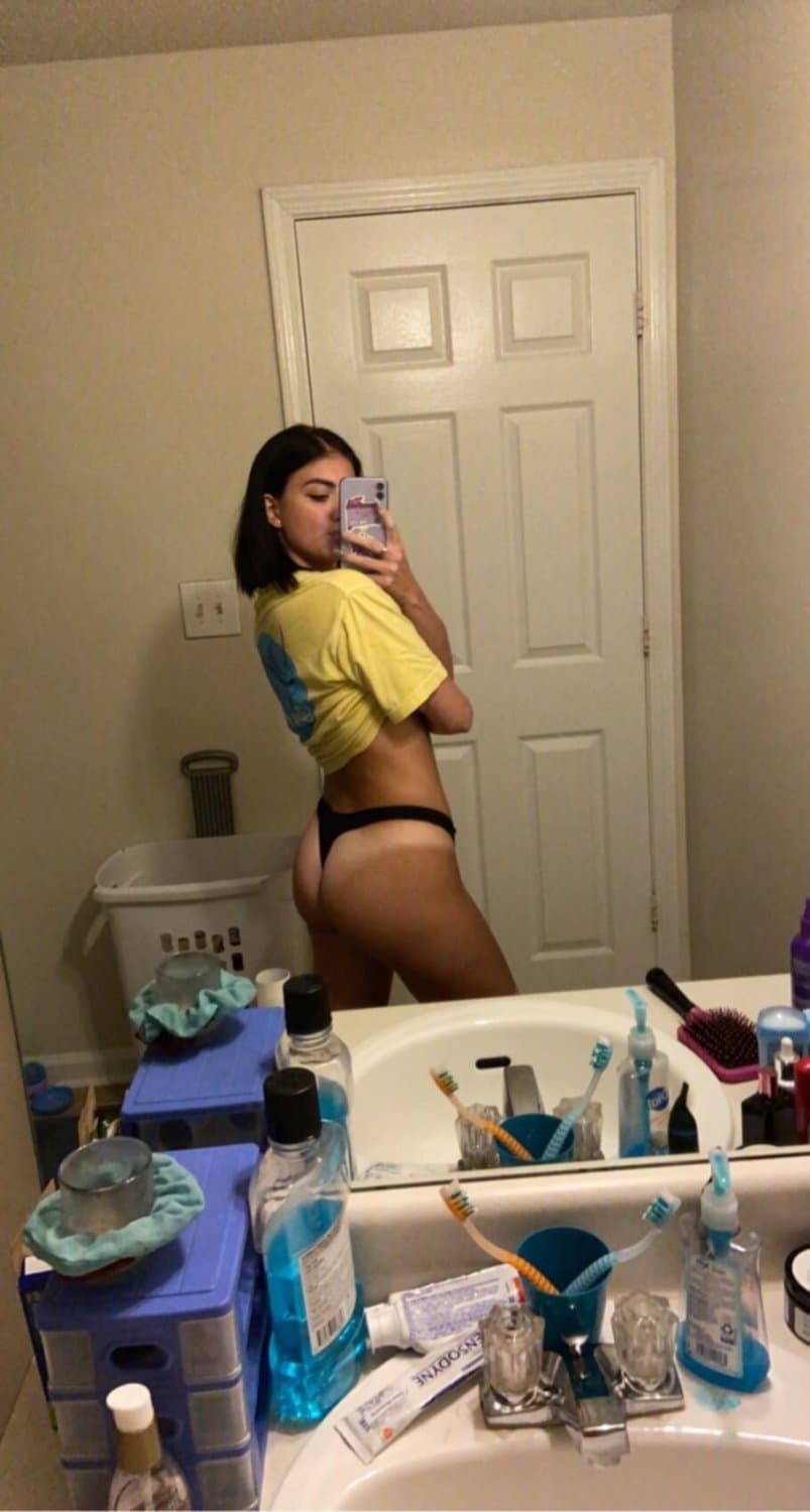 Sexy brunette with tattoos and pierced nipples