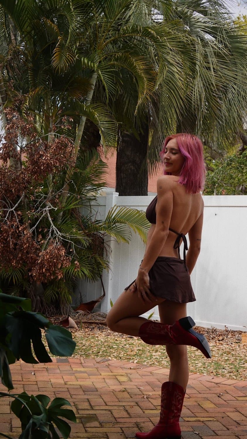 Photo shared by ★CLOUDSWORLD★ on March 14, 2025 tagging @zachdaye.May be an image of 1 person, miniskirt, fishnet stockings, outdoors and text