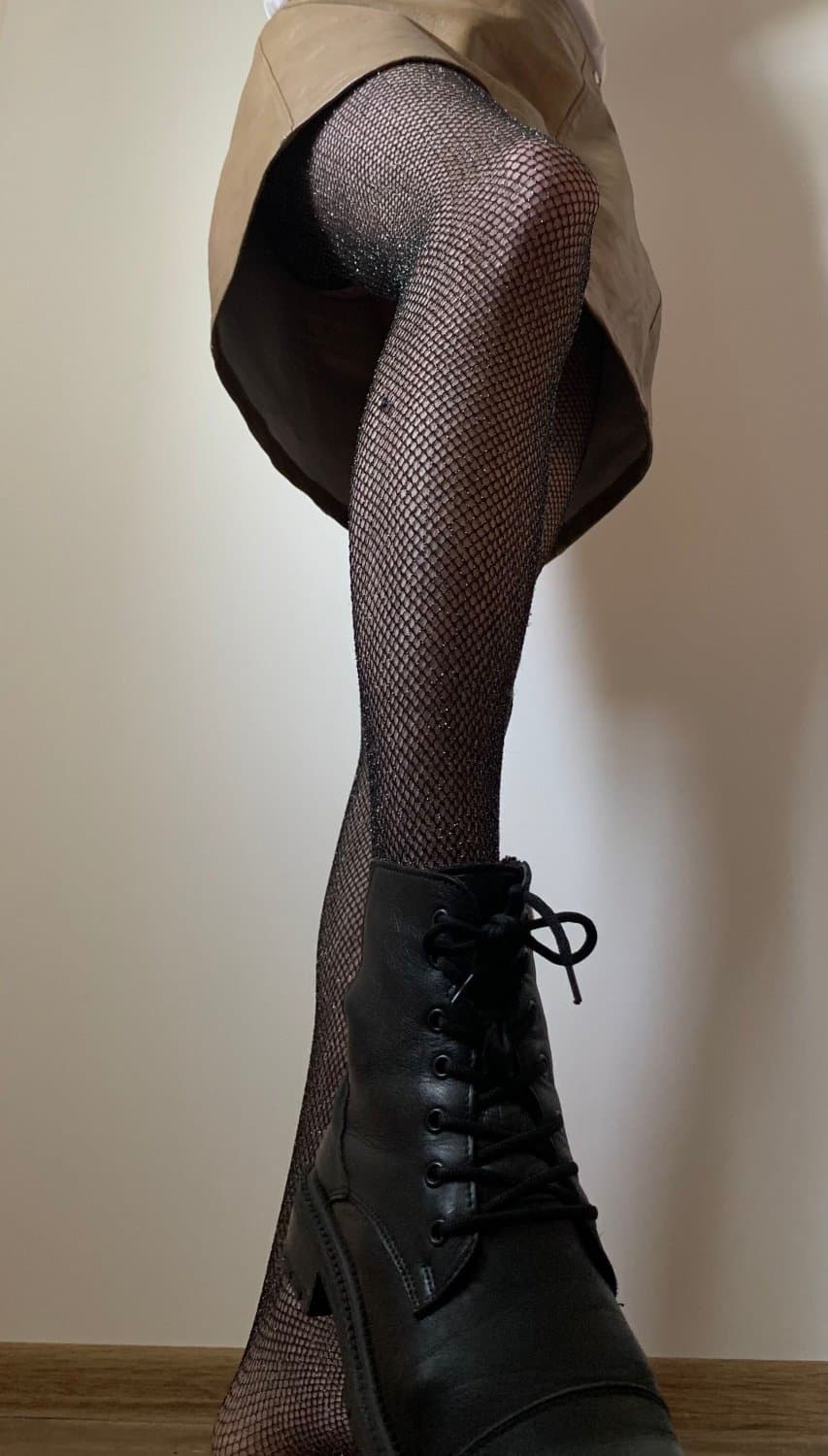 Kate Sissy Cl1412 showing her in leather skirt and fishnets