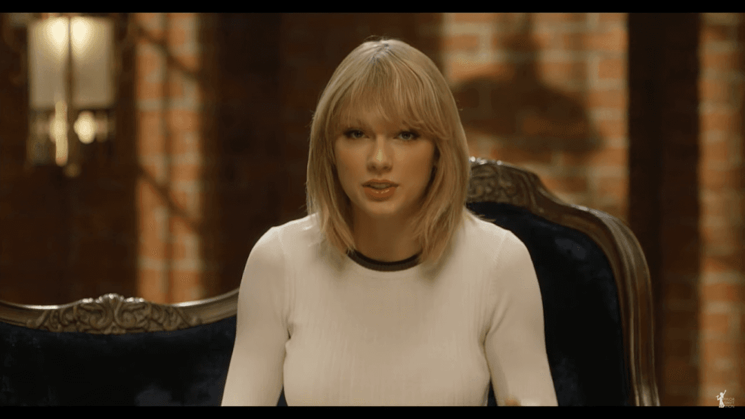 Taylor Swift tight white sweater, leather skirt, leather heels