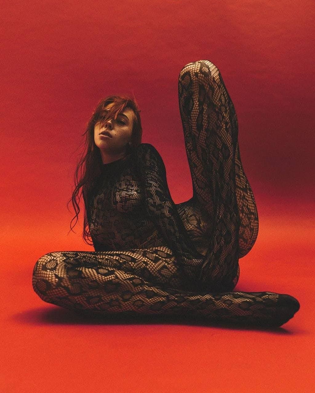 Sexy brunette in fishnets pantyhose