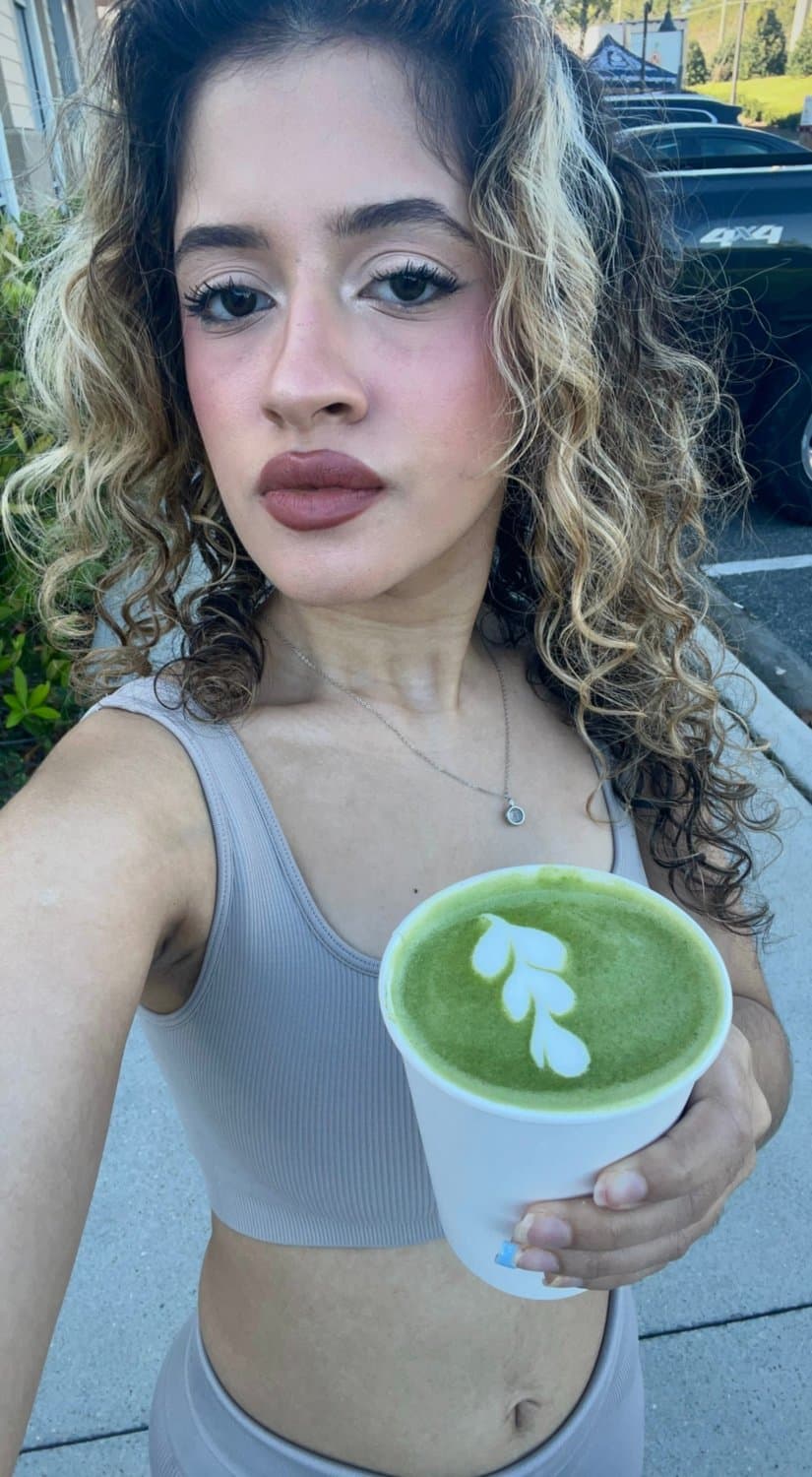 Hot slut drinking her hot matcha drink in the morning