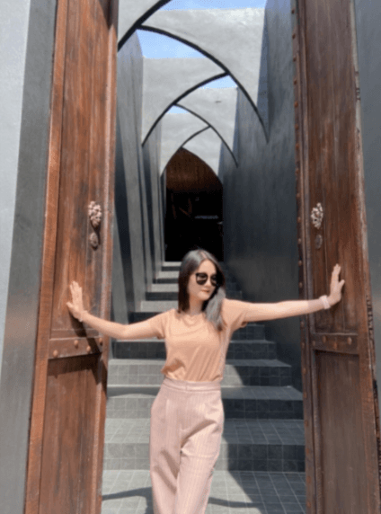 Her husband wants us to see her beautiful figure.