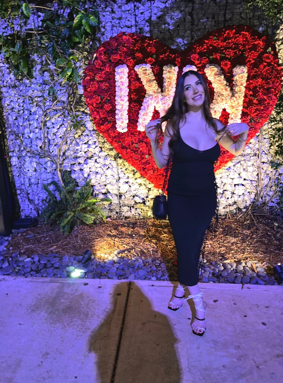 Sexy chick in a black dress is all you need tonight