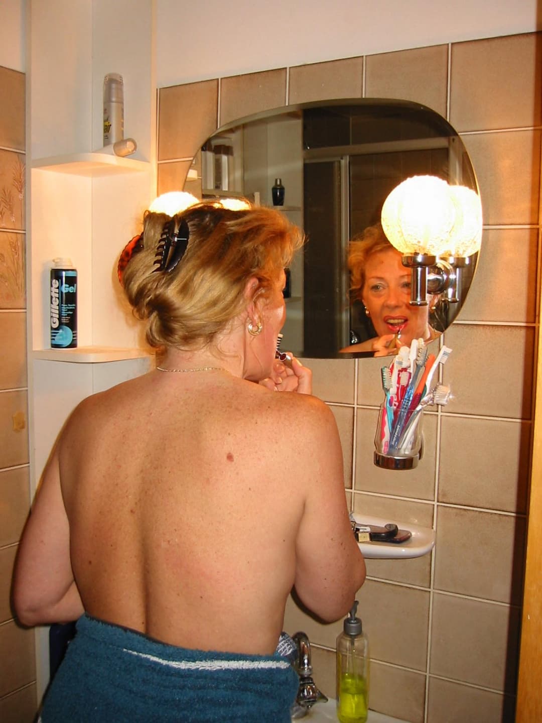 Old slut gets ready for friends in the bathroom