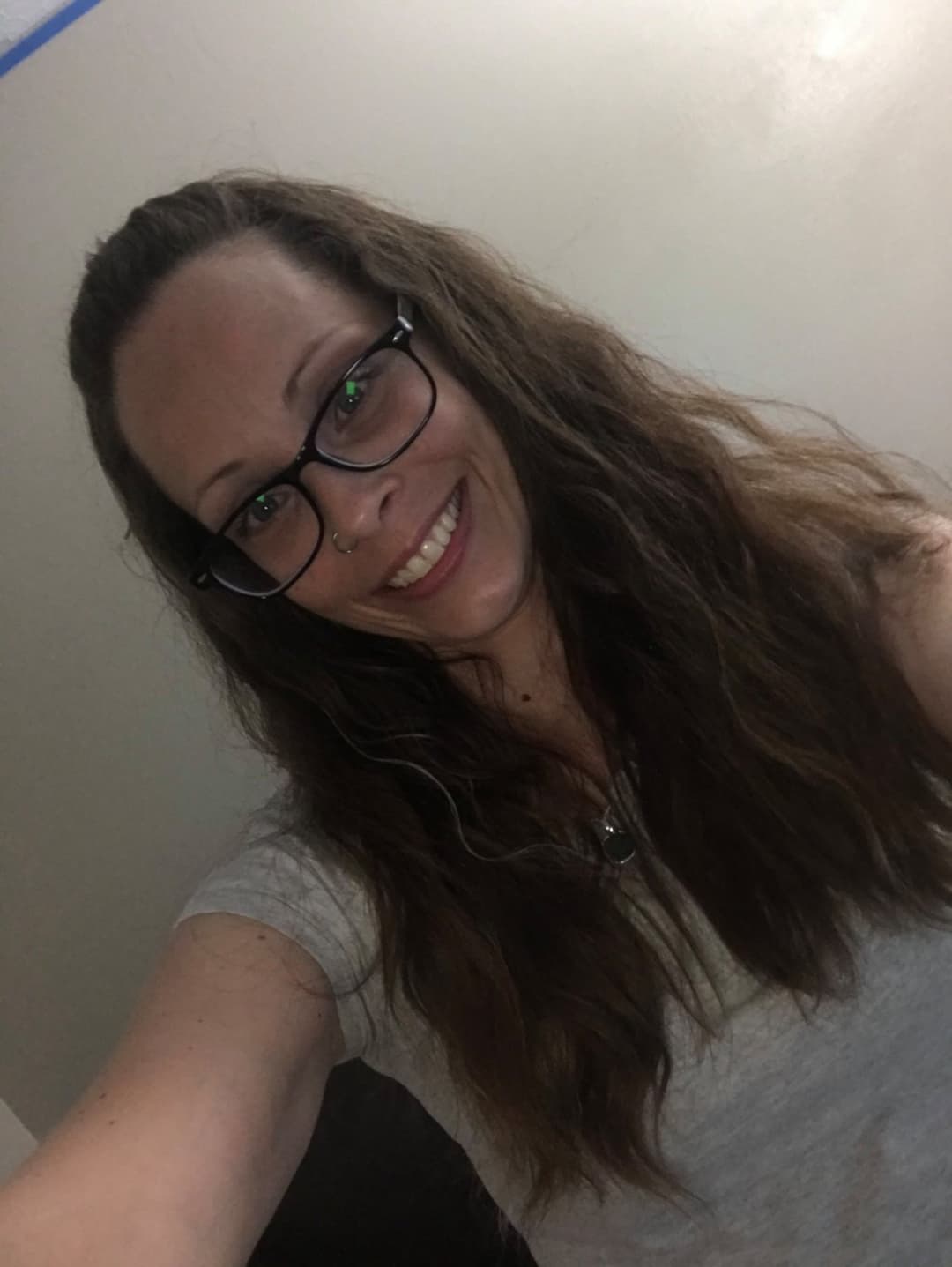 Click to view full size Tricia sneaks off to give a quick look at her titties