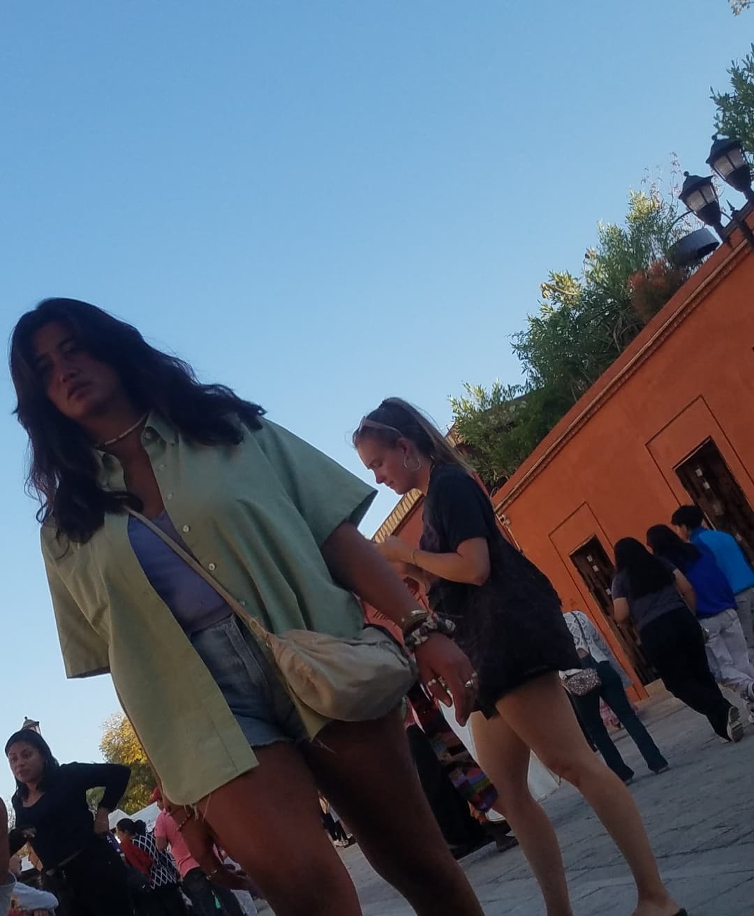 2 friends, blonde and brunette, in shorts, nice legs