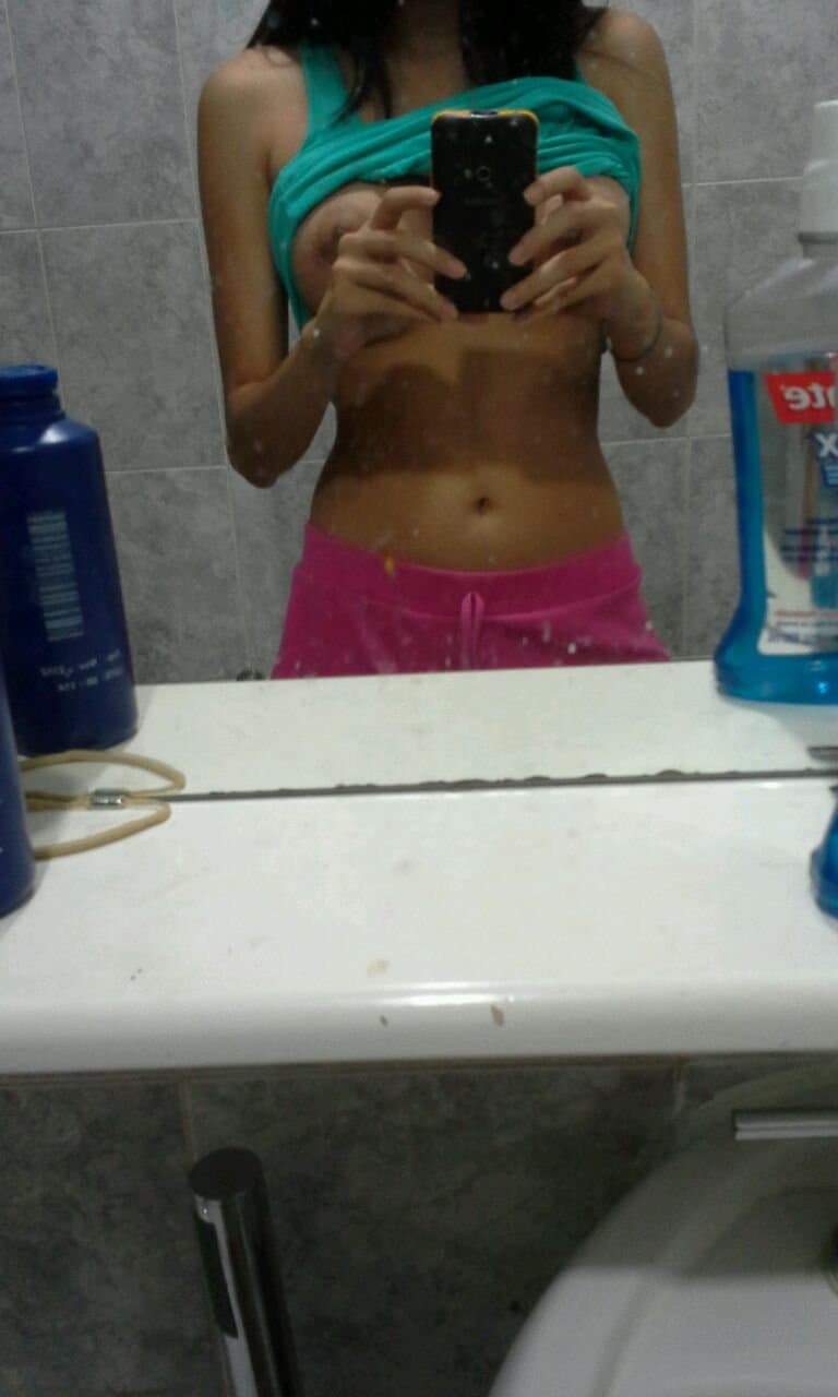 Brunette slut fake tits pretty smile