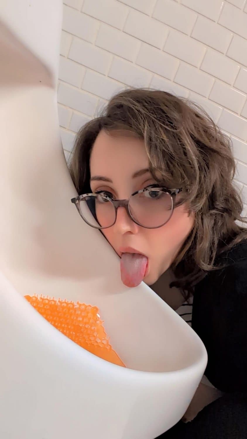 humiliated dumb slut licks urinal