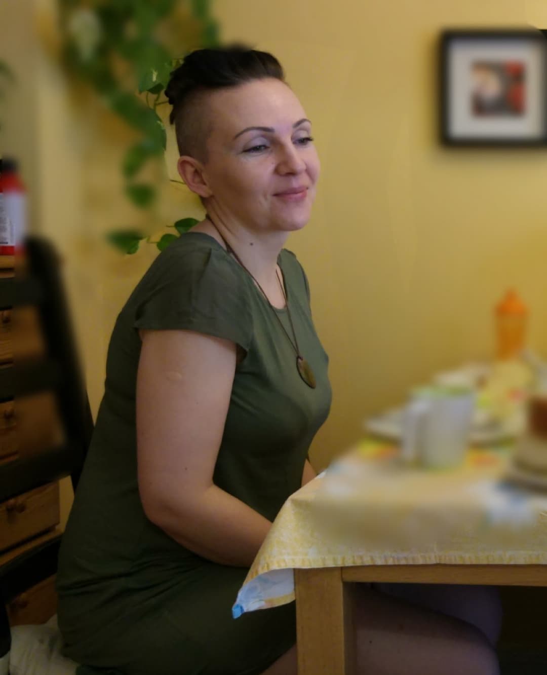 Click to view full size Very pretty MILF spreads her legs on the sofa.