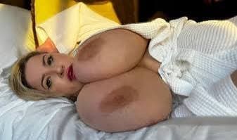 British MILF flashing her giant tits in public.....