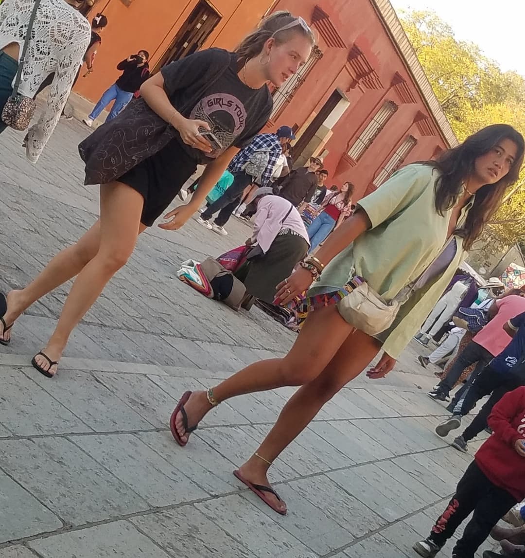 2 friends, blonde and brunette, in shorts, nice legs