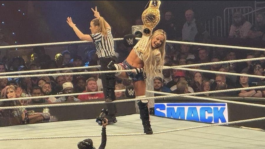 Liv Morgan in tiny plaid skirt