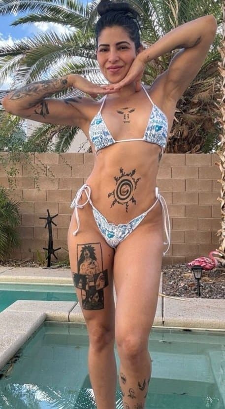 Fit tattoed Latina fighter teen